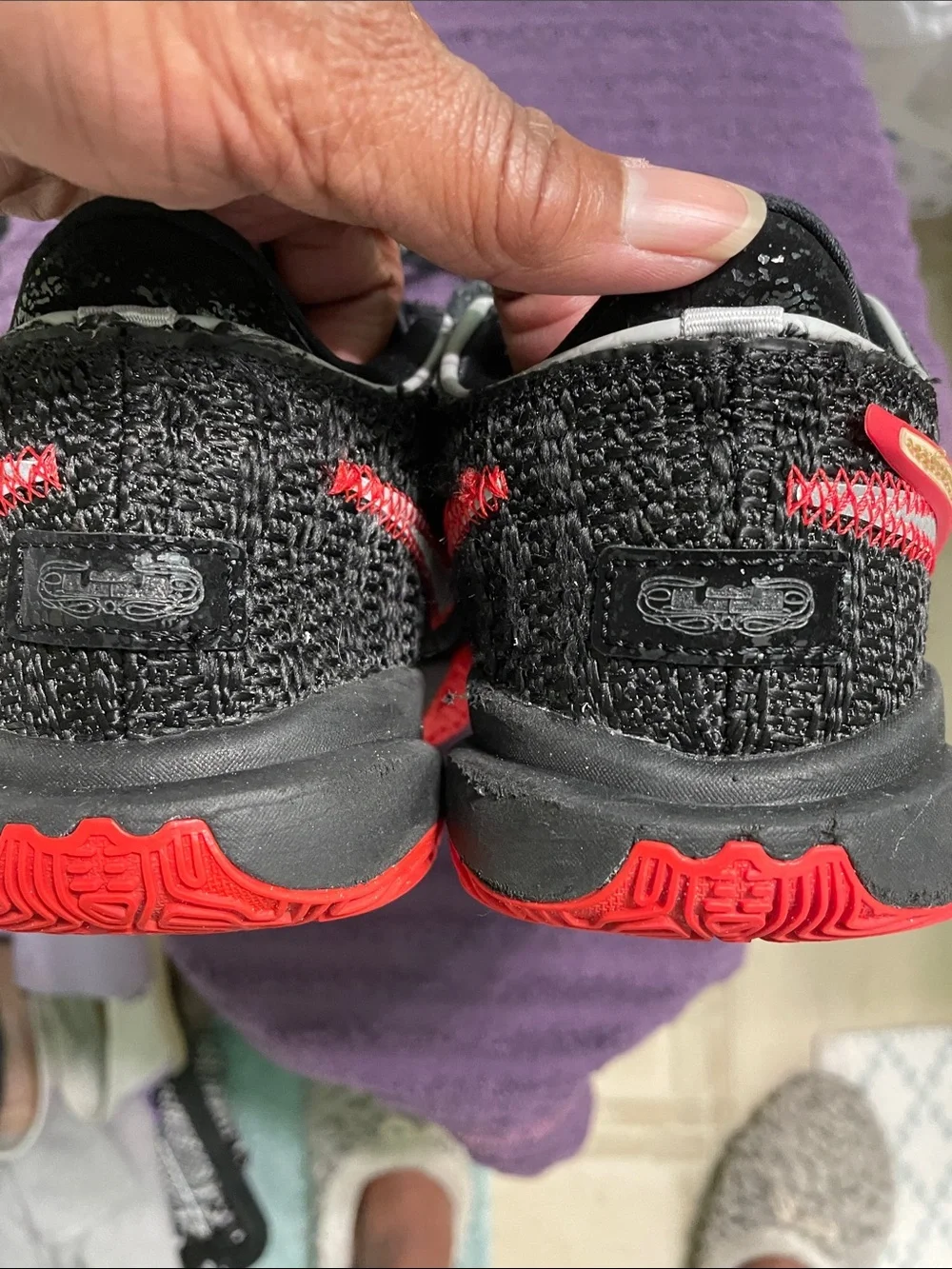 Nike Black Knit Sneakers with Gold Swoosh and Red Accents